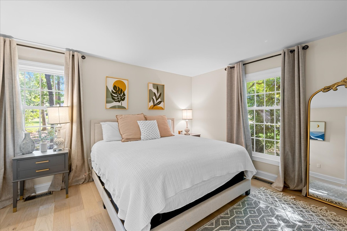 Second master bedroom with coastal artwork